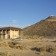 Illustration for article titled A House Shaped Like a Flying Saucer, Perched Atop a Volcano